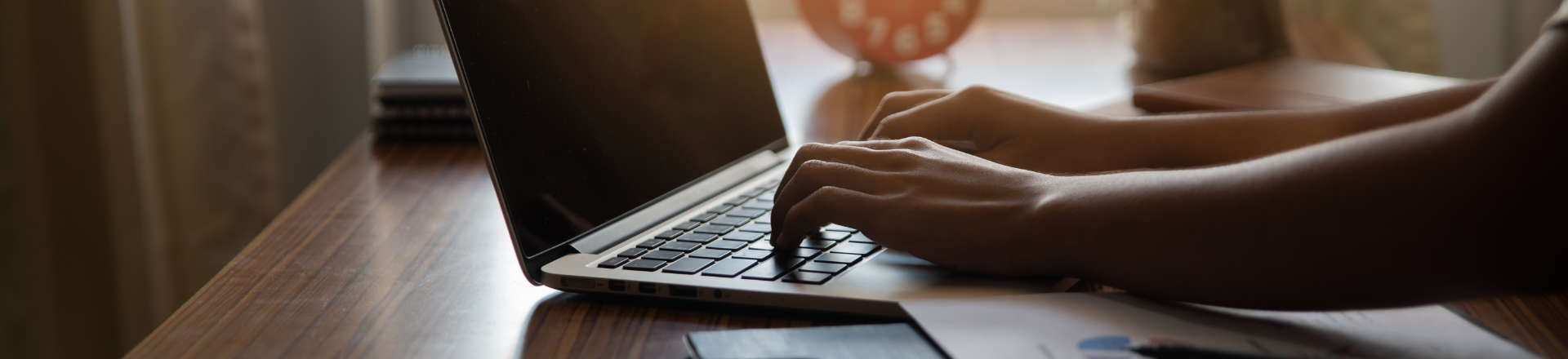 a person typing on a laptop