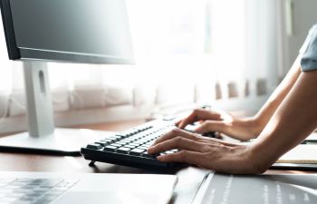 An office worker working on a computer.